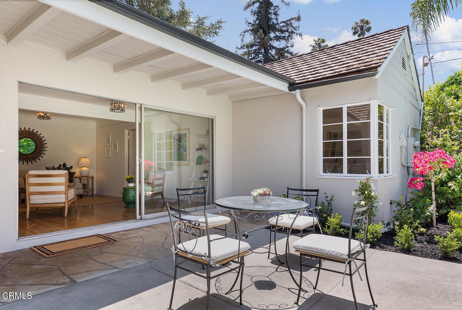 2115 Roanoke Road San Marino, CA 91108 - Photo 8 of 8 a patio with a table and chairs and potted plants