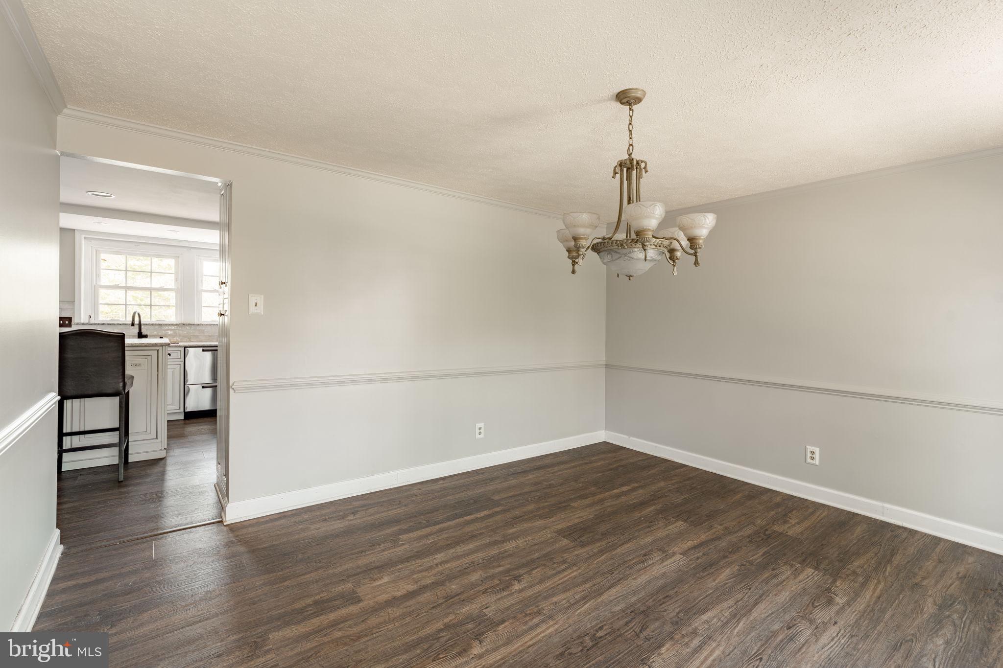 2072 Spring Valley Road Lansdale, PA 19446 - Photo 12 of 48 an empty room with wooden floor and ceiling fan