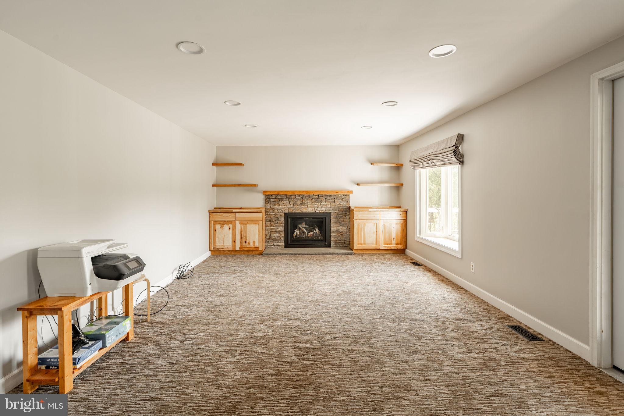 2072 Spring Valley Road Lansdale, PA 19446 - Photo 13 of 48 an empty room with fireplace and windows