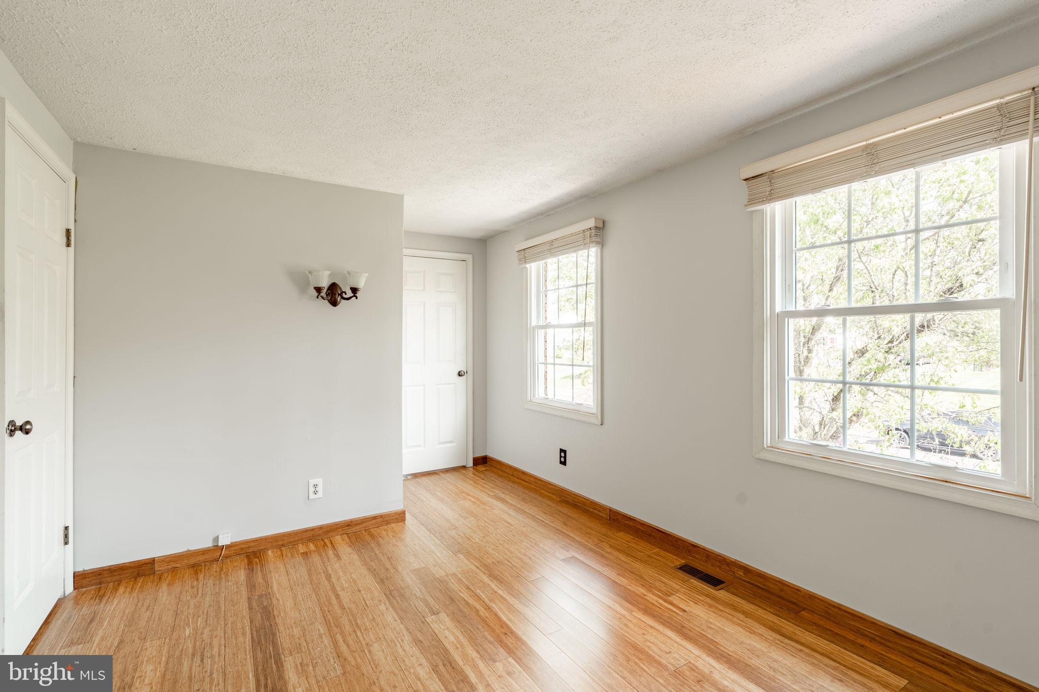 2072 Spring Valley Road Lansdale, PA 19446 - Photo 23 of 48 an empty room with wooden floor and windows