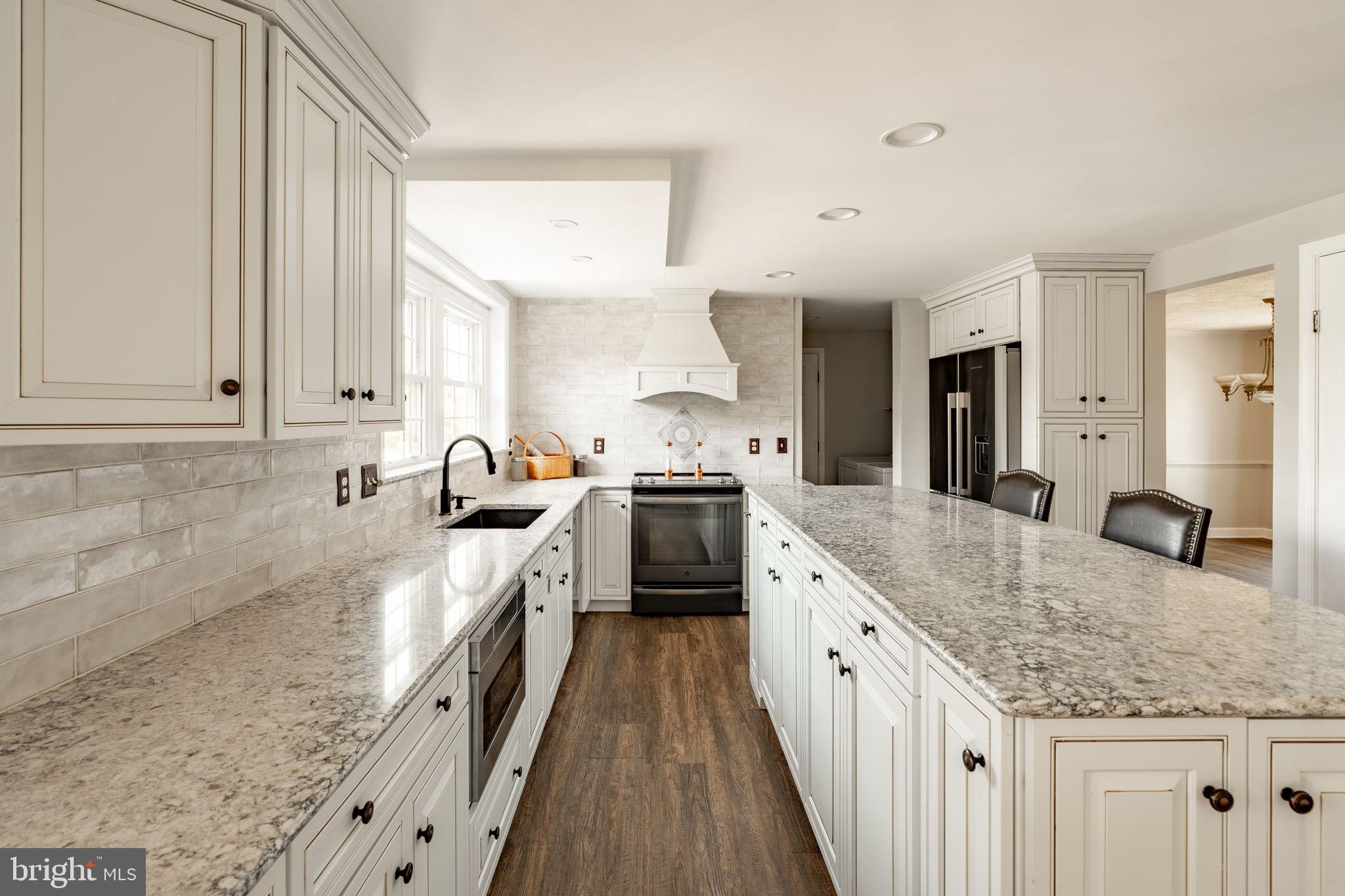 2072 Spring Valley Road Lansdale, PA 19446 - Photo 4 of 48 a large kitchen with granite countertop a sink and cabinets
