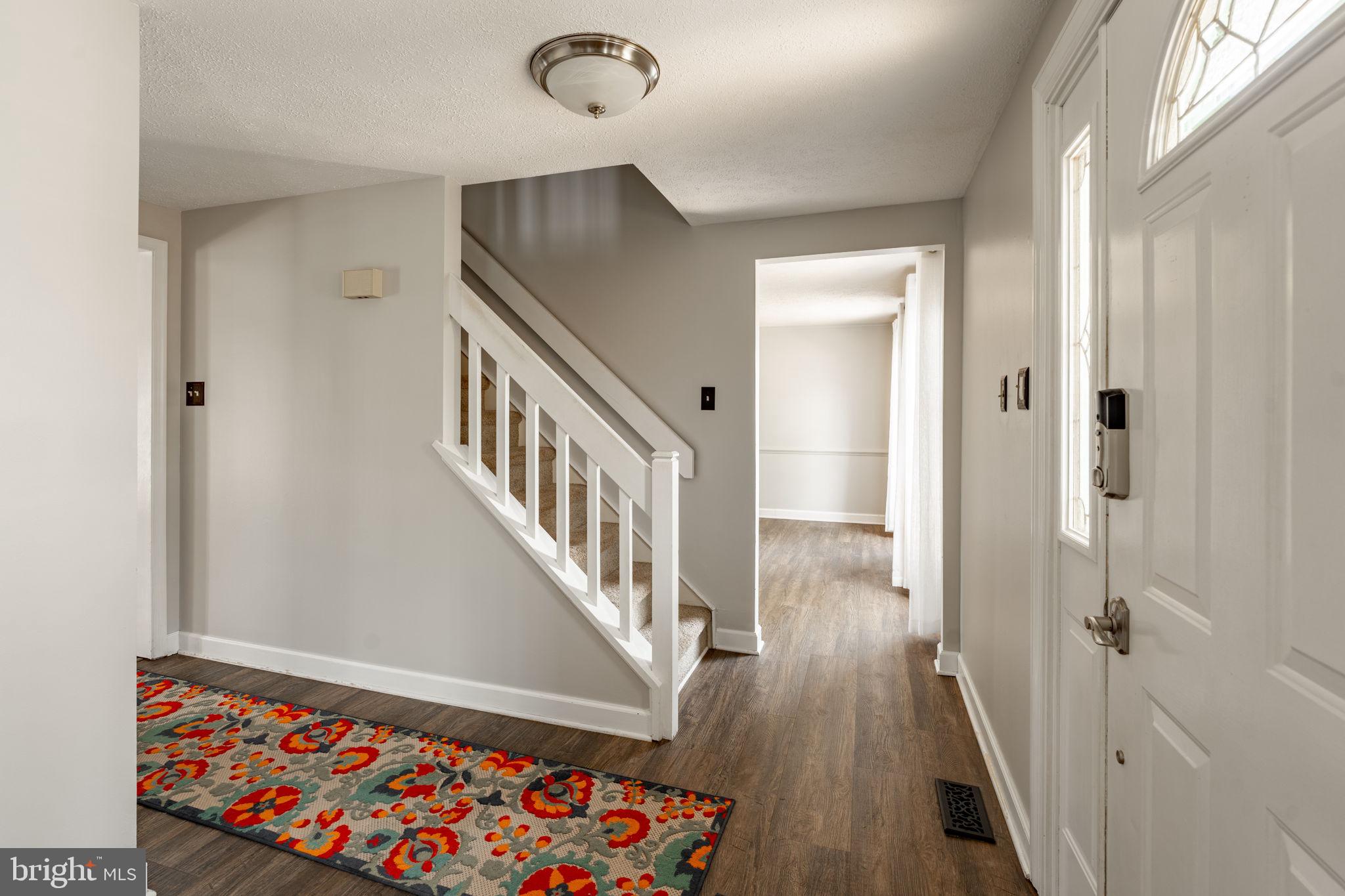 2072 Spring Valley Road Lansdale, PA 19446 - Photo 8 of 48 a view of entryway with stairs and wooden floor