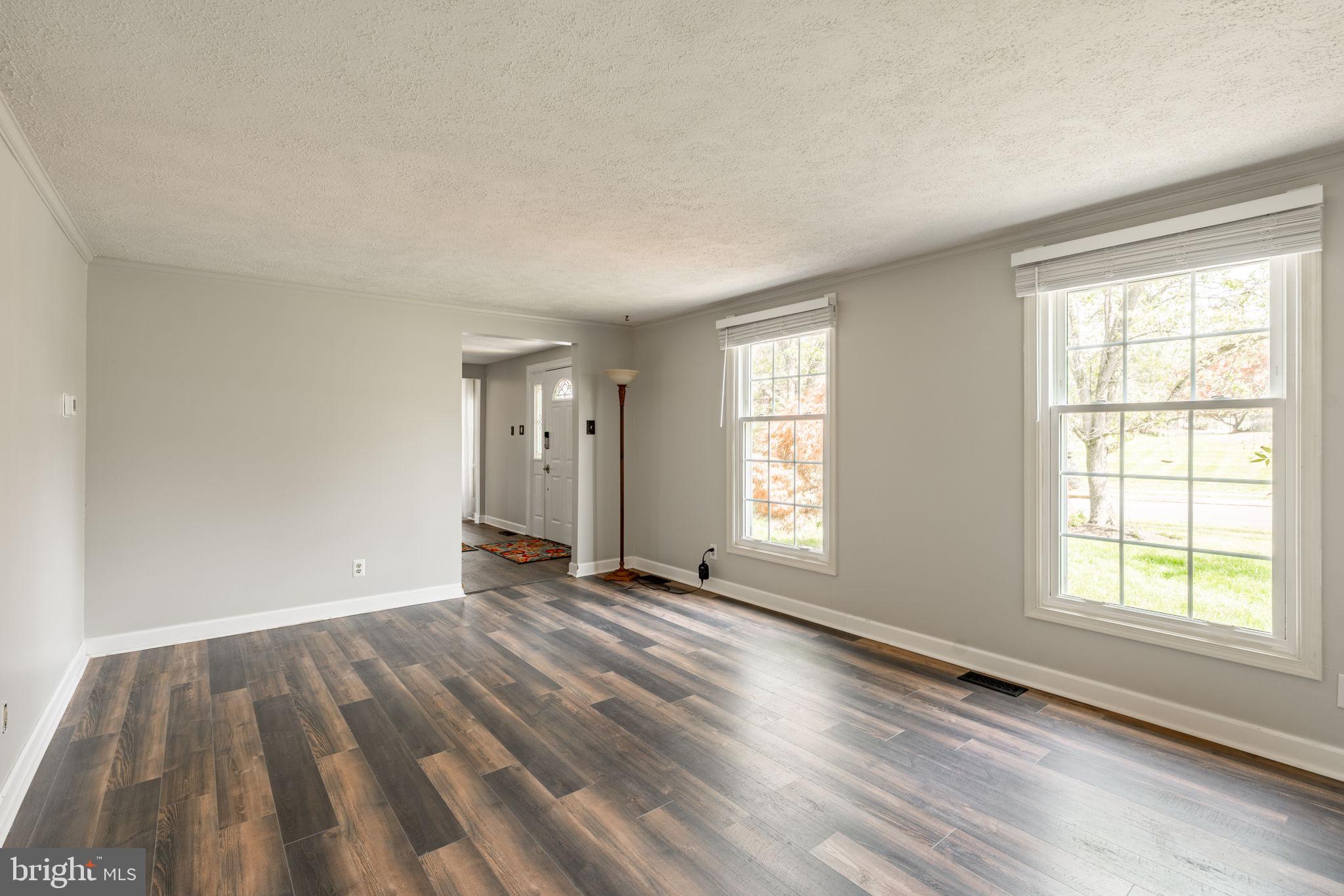 2072 Spring Valley Road Lansdale, PA 19446 - Photo 10 of 48 a view of an empty room with wooden floor and a window