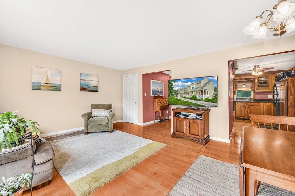 45 Boston Road, Unit C Sutton, MA 01590 - Photo 11 of 35 a living room with furniture and a flat screen tv