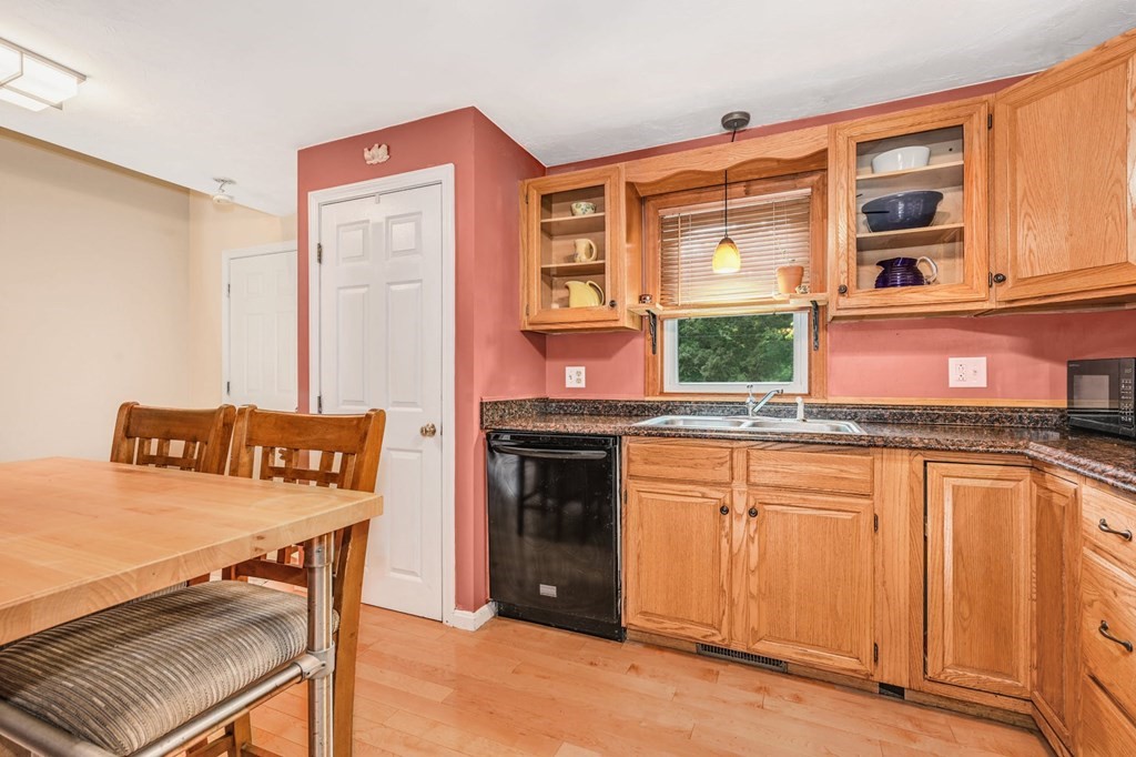 45 Boston Road, Unit C Sutton, MA 01590 - Photo 14 of 35 a kitchen with stainless steel appliances granite countertop a stove and a refrigerator