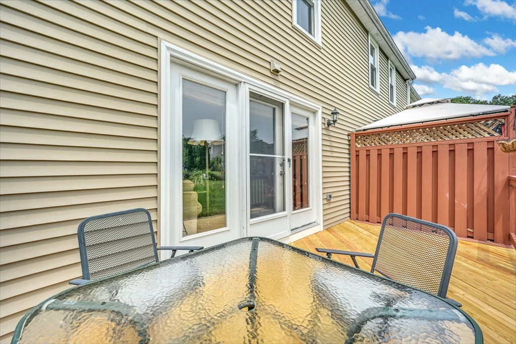 45 Boston Road, Unit C Sutton, MA 01590 - Photo 26 of 35 a view of a house with a balcony and furniture