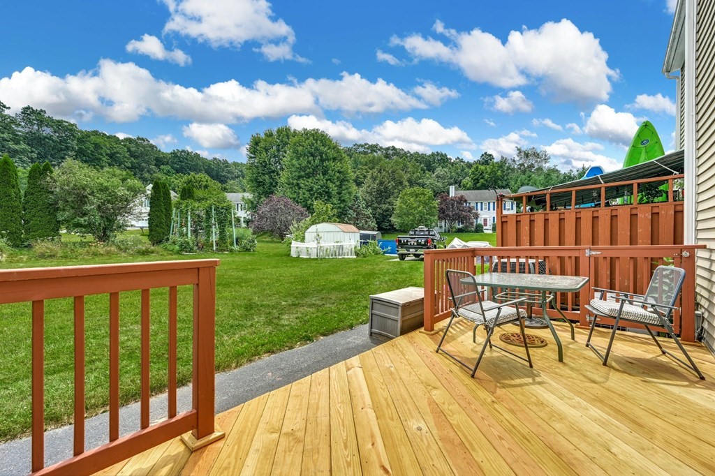 45 Boston Road, Unit C Sutton, MA 01590 - Photo 28 of 35 a view of a chair and tables on the patio