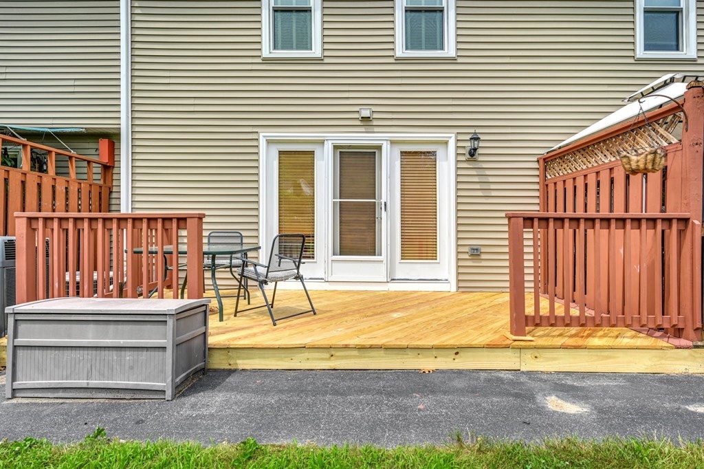 45 Boston Road, Unit C Sutton, MA 01590 - Photo 30 of 35 a view of a house with a backyard and a tub