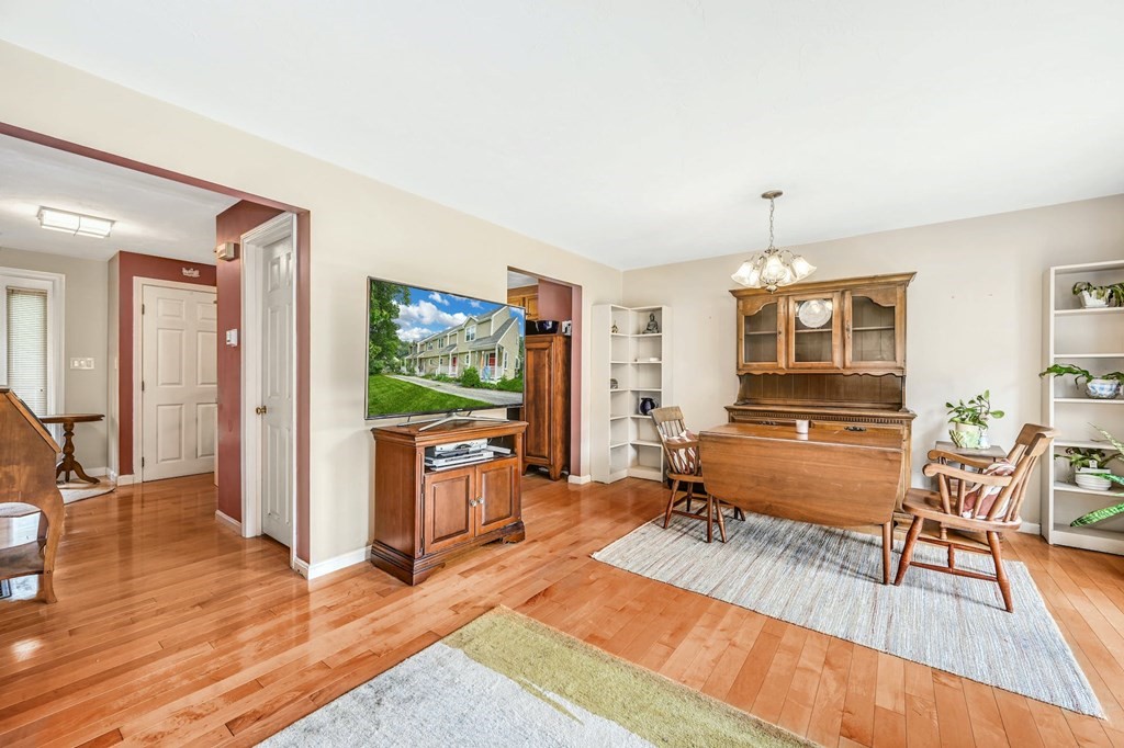 45 Boston Road, Unit C Sutton, MA 01590 - Photo 10 of 35 a living room with furniture and a wooden floor
