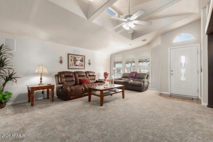 3301 South Goldfield Road, Unit 4086 Apache Junction, AZ 85119 - Photo 15 of 41 a living room with furniture and a chandelier