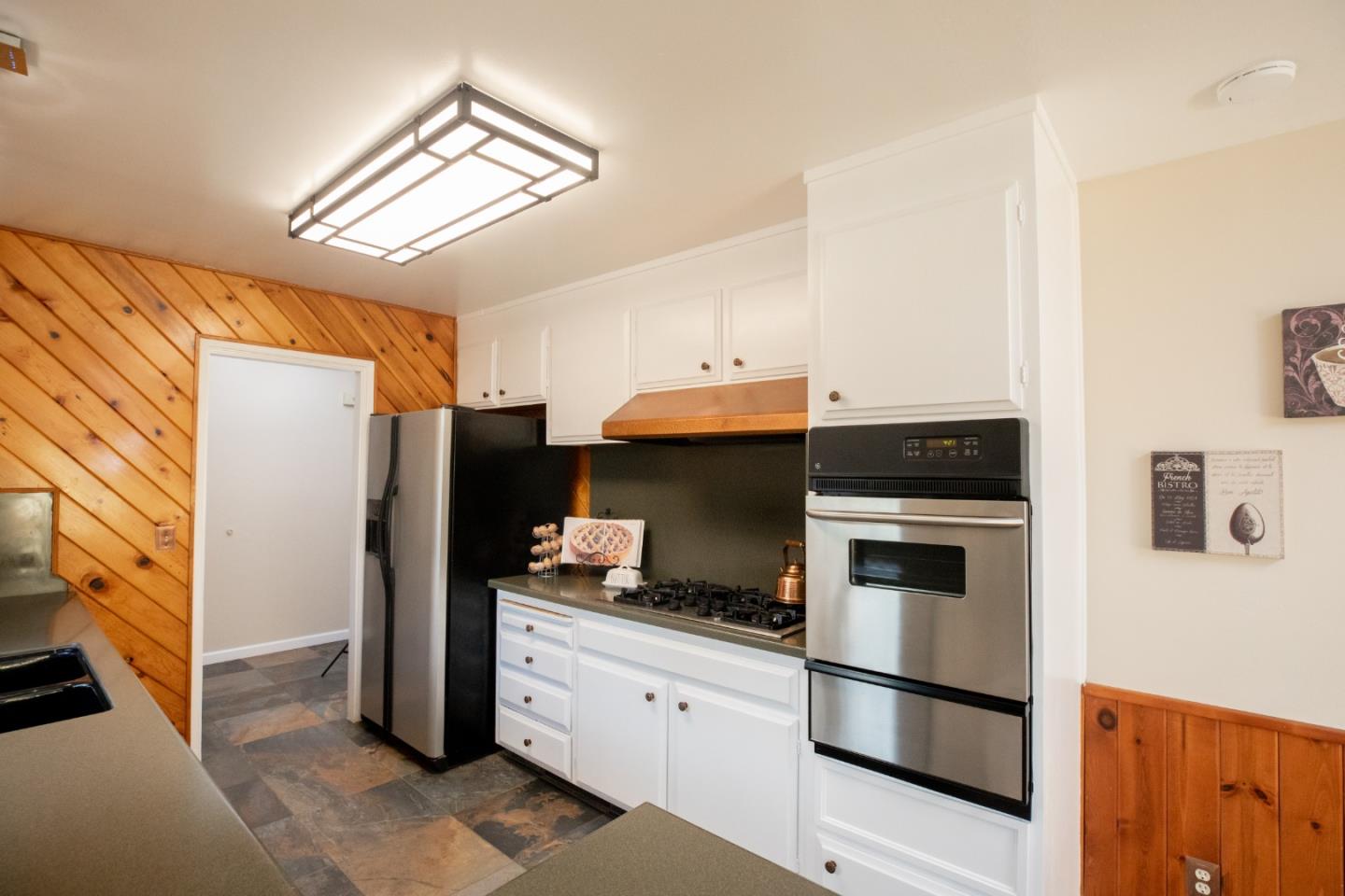 1163 Crespi Drive Sunnyvale, CA 94086 - Photo 15 of 49 a kitchen with a refrigerator and a stove