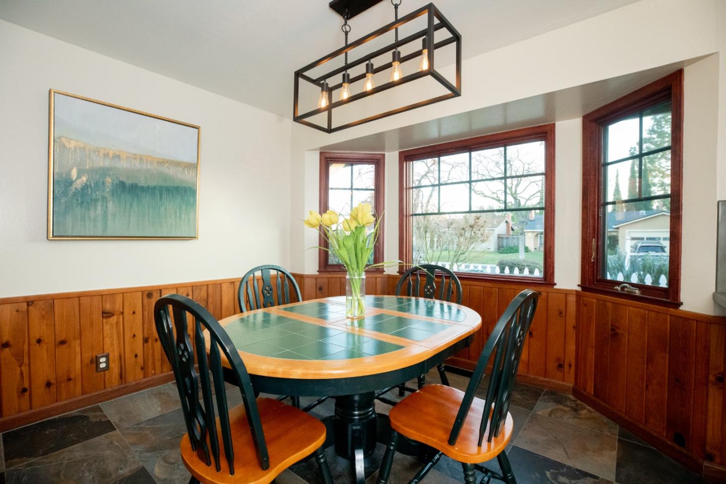1163 Crespi Drive Sunnyvale, CA 94086 - Photo 17 of 49 a dining room with furniture a chandelier and wooden floor