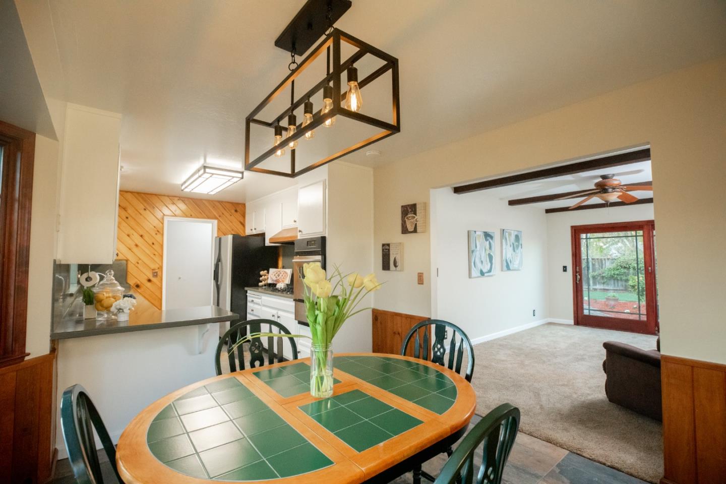 1163 Crespi Drive Sunnyvale, CA 94086 - Photo 20 of 49 a dining room with furniture a rug and wooden floor