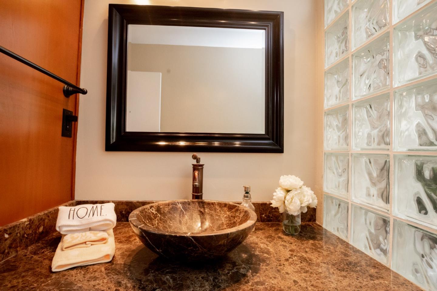 1163 Crespi Drive Sunnyvale, CA 94086 - Photo 28 of 49 a bathroom with a toilet sink and mirror