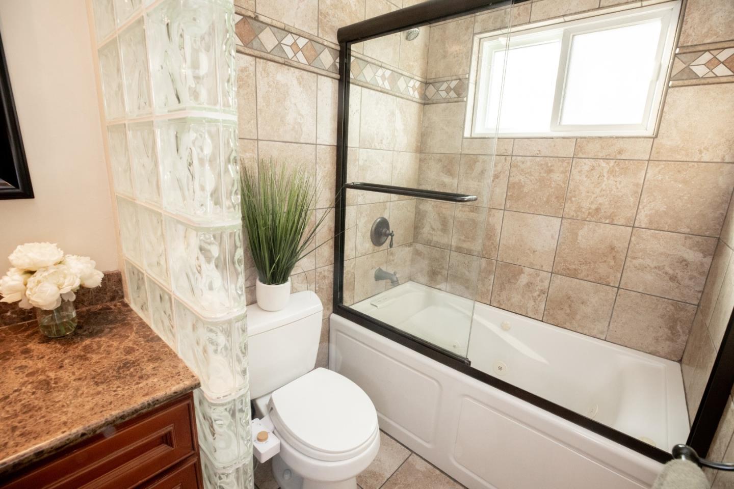 1163 Crespi Drive Sunnyvale, CA 94086 - Photo 29 of 49 a bathroom with a sink a toilet and shower