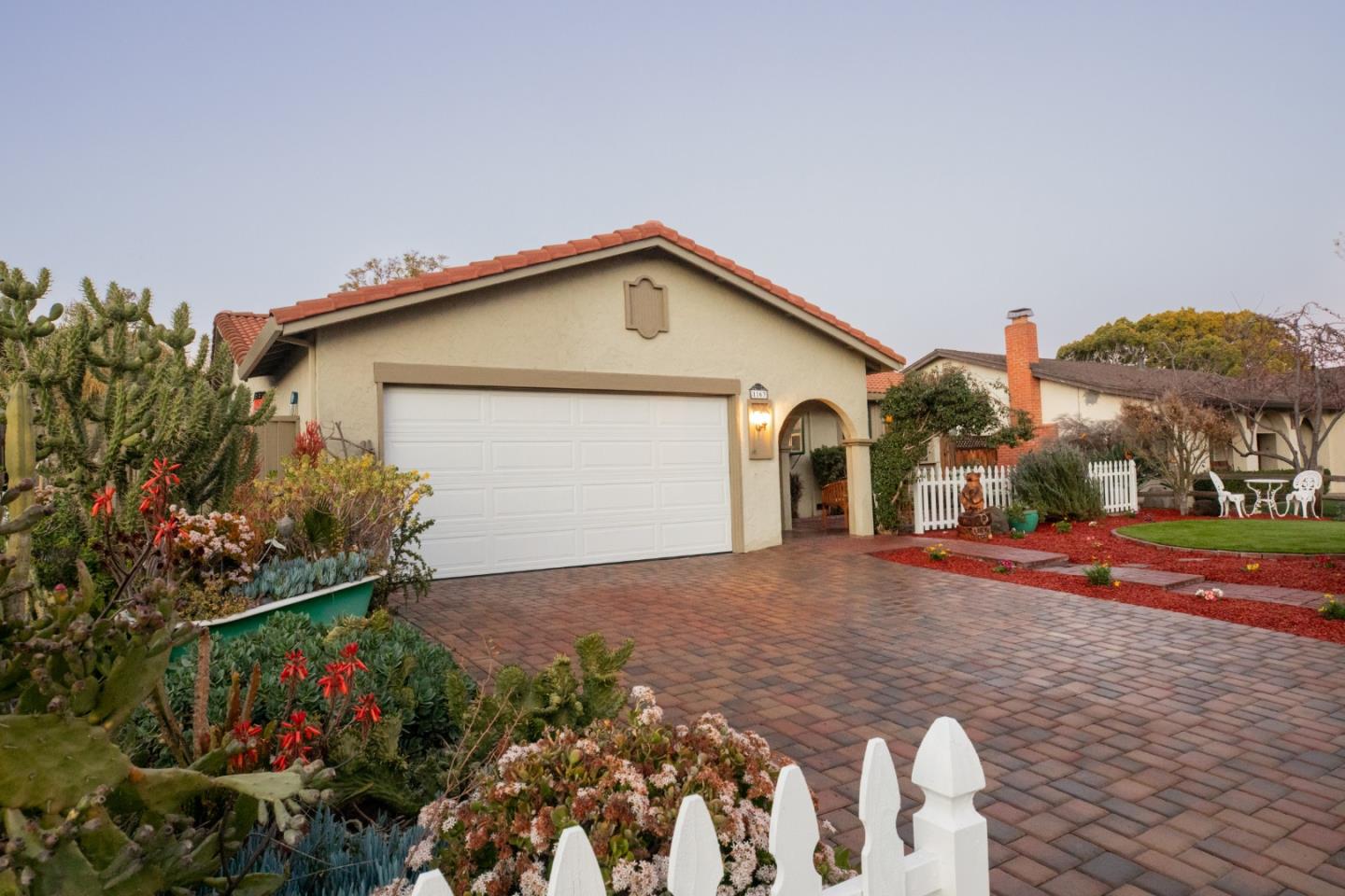 1163 Crespi Drive Sunnyvale, CA 94086 - Photo 3 of 49 a front view of a house with a yard and garage