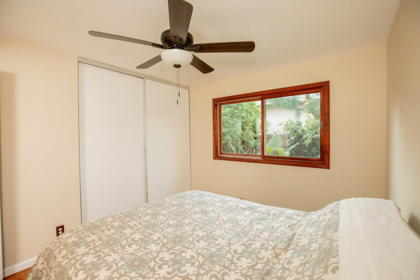 1163 Crespi Drive Sunnyvale, CA 94086 - Photo 31 of 49 a bedroom with a bed and a window