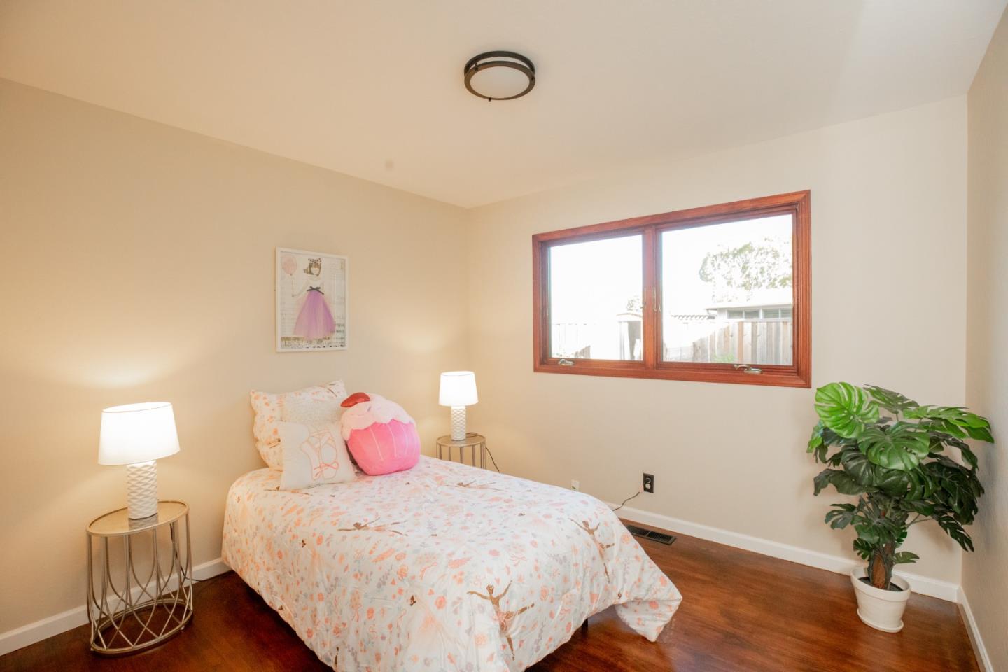 1163 Crespi Drive Sunnyvale, CA 94086 - Photo 33 of 49 a bedroom with a bed and a potted plant