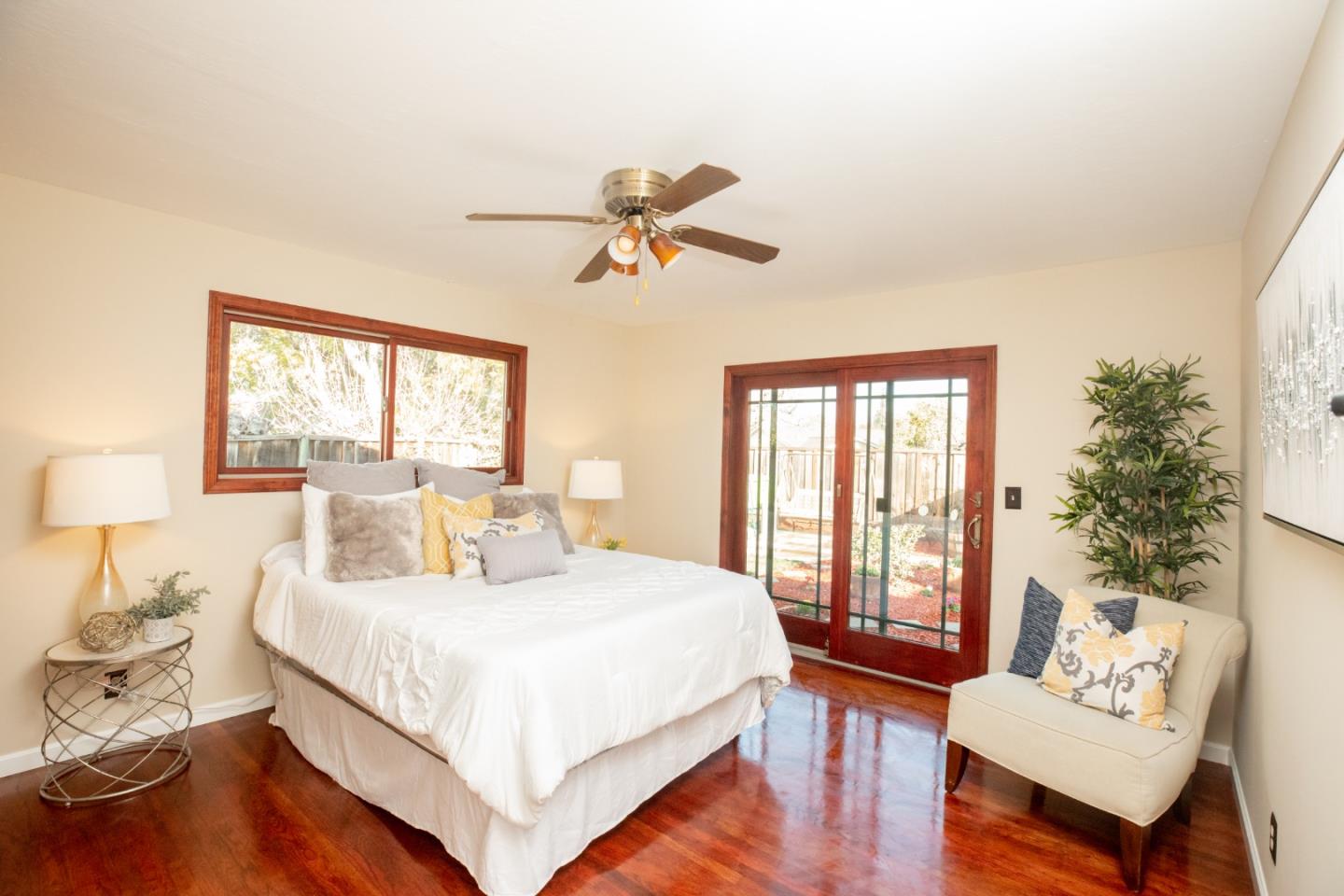 1163 Crespi Drive Sunnyvale, CA 94086 - Photo 35 of 49 a bedroom with a bed and wooden floor