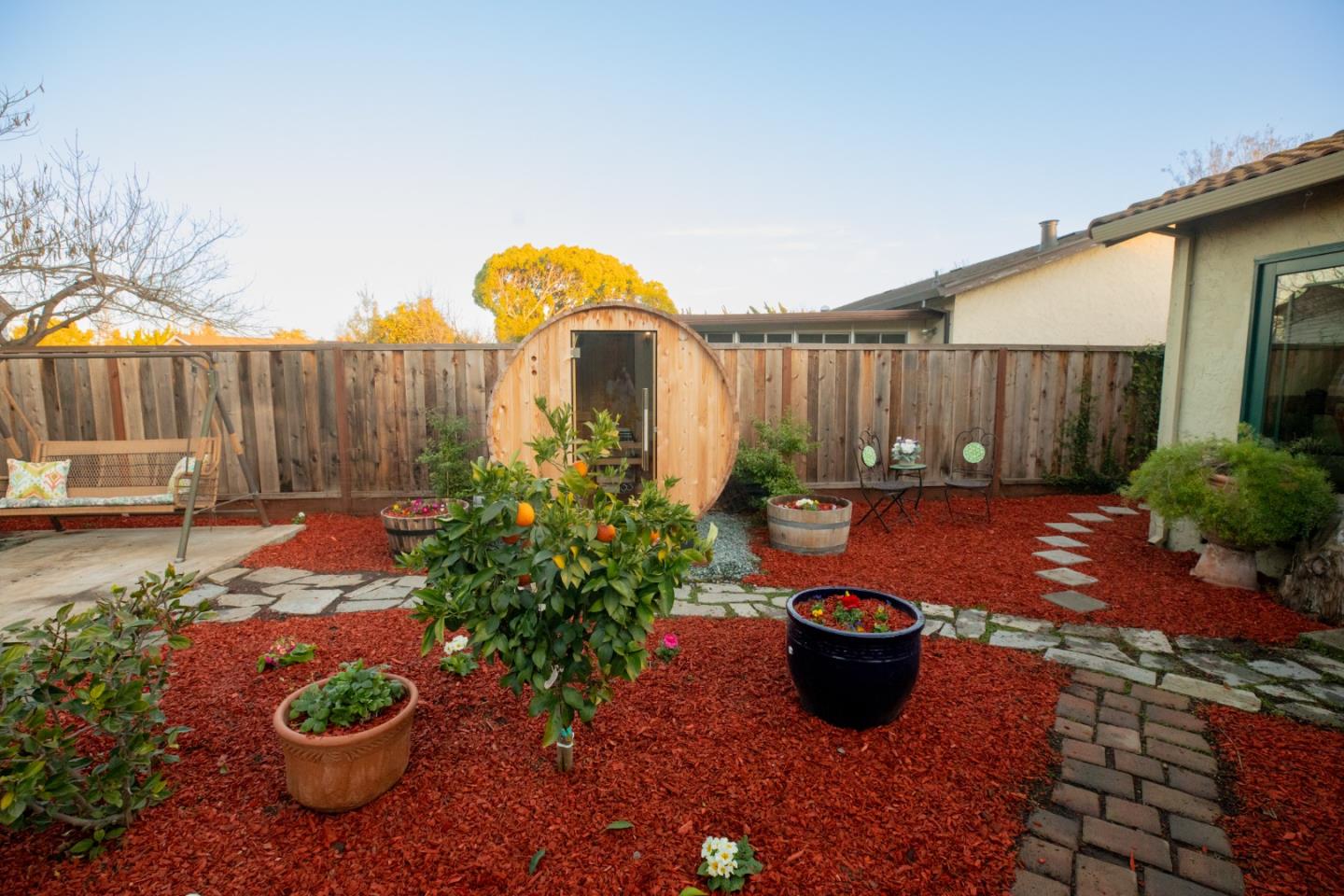 1163 Crespi Drive Sunnyvale, CA 94086 - Photo 44 of 49 a view of a backyard with plants and a chair