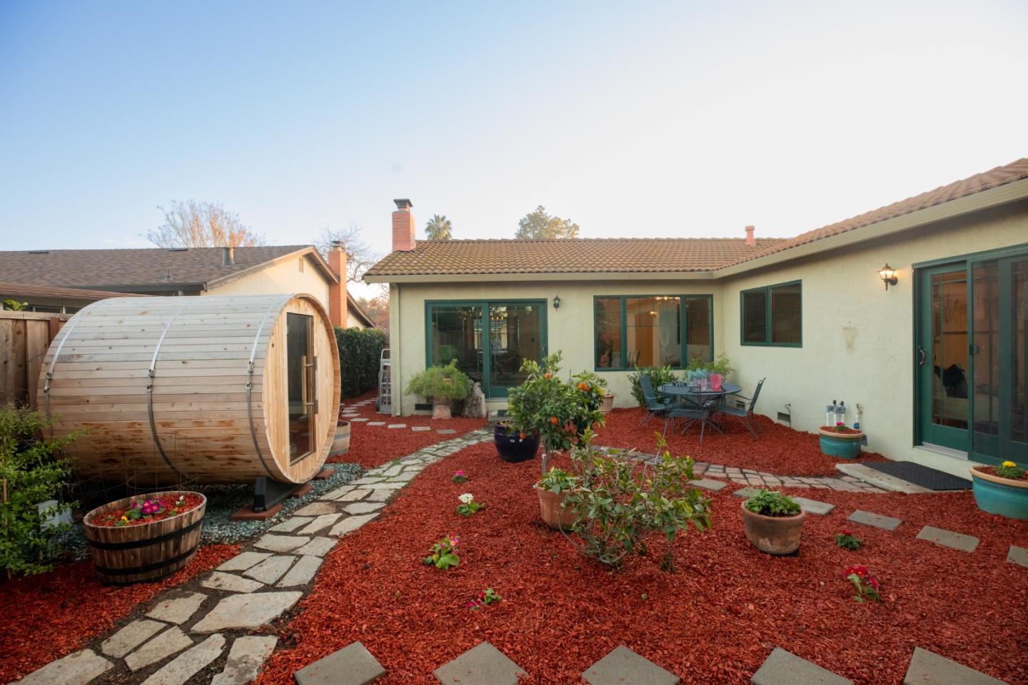 1163 Crespi Drive Sunnyvale, CA 94086 - Photo 48 of 49 a view of a house with backyard sitting area and garden