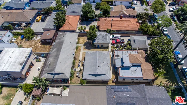 an aerial view of houses with outdoor space