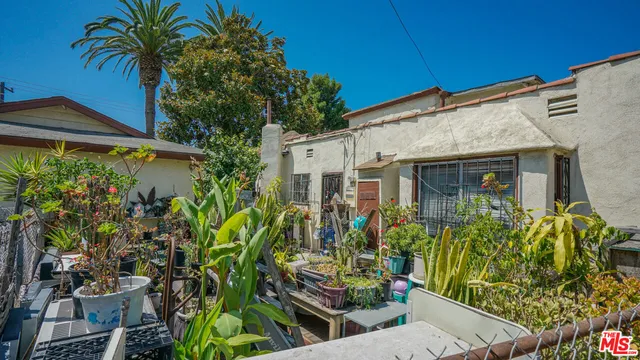 front view of a house with a potted plant