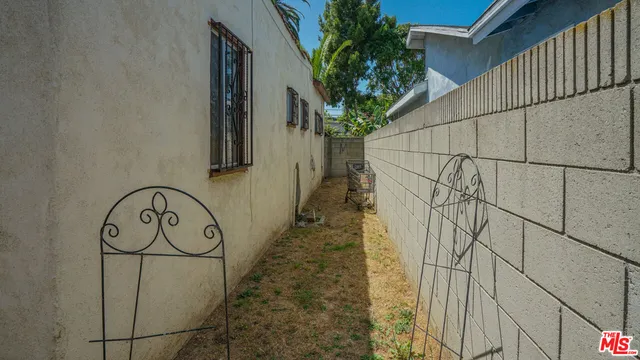 a white house with a tree in front of it