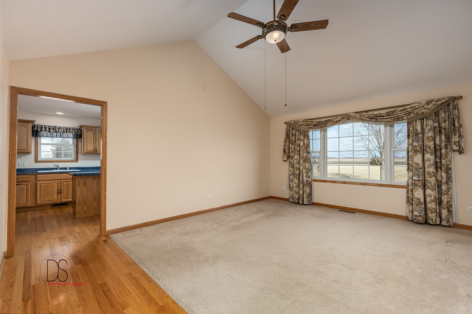 3976 East 2259th Road Serena, IL 60549 - Photo 4 of 24 a view of an empty room with a window and wooden floor
