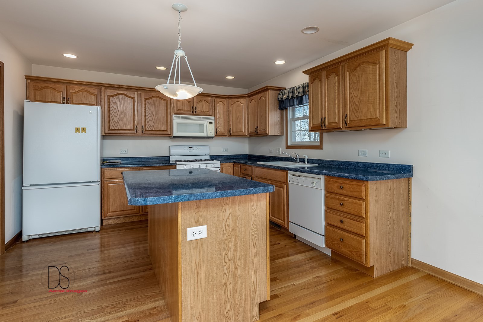 3976 East 2259th Road Serena, IL 60549 - Photo 5 of 24 a kitchen with stainless steel appliances granite countertop a sink stove and refrigerator
