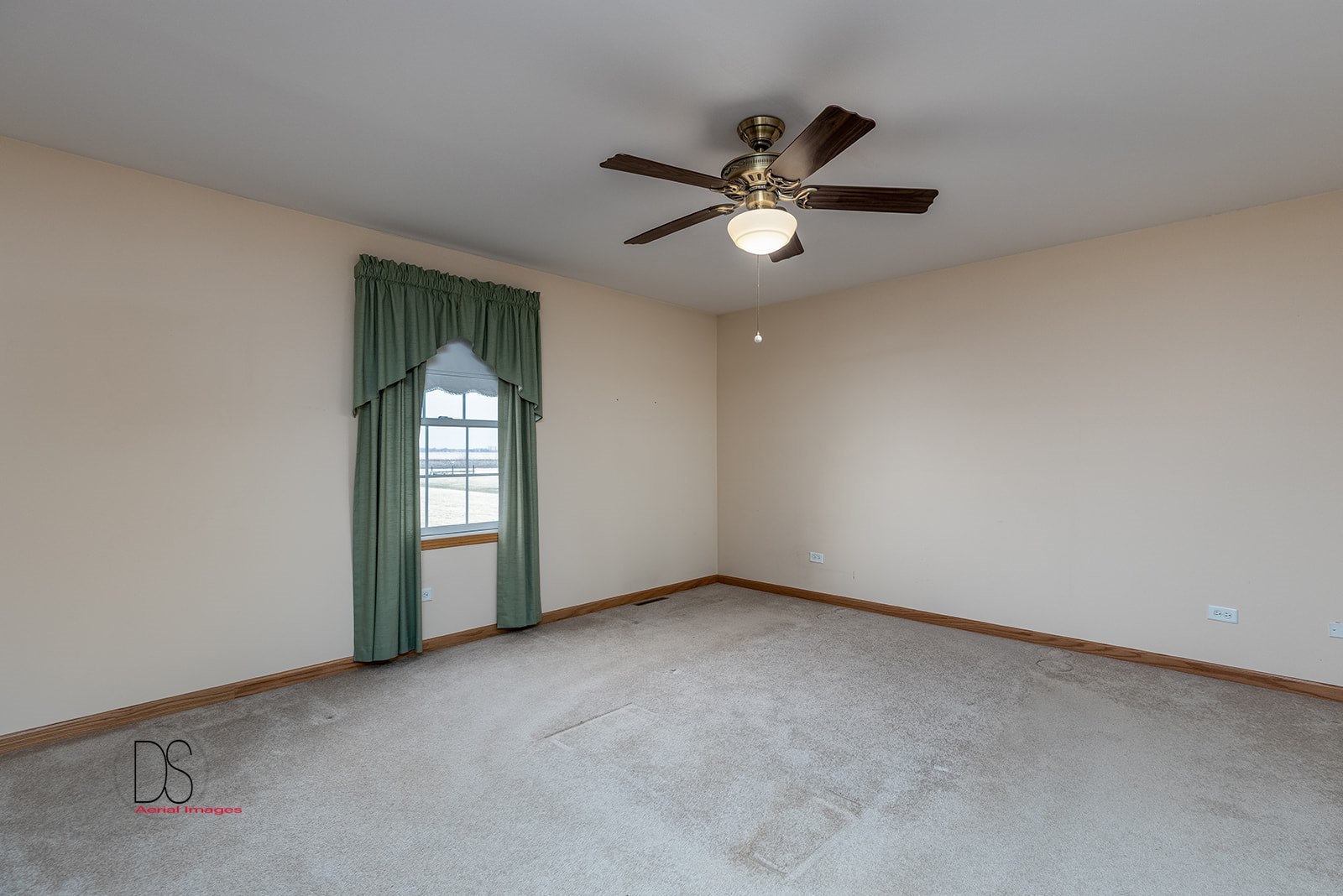 3976 East 2259th Road Serena, IL 60549 - Photo 8 of 24 an empty room with windows and fan
