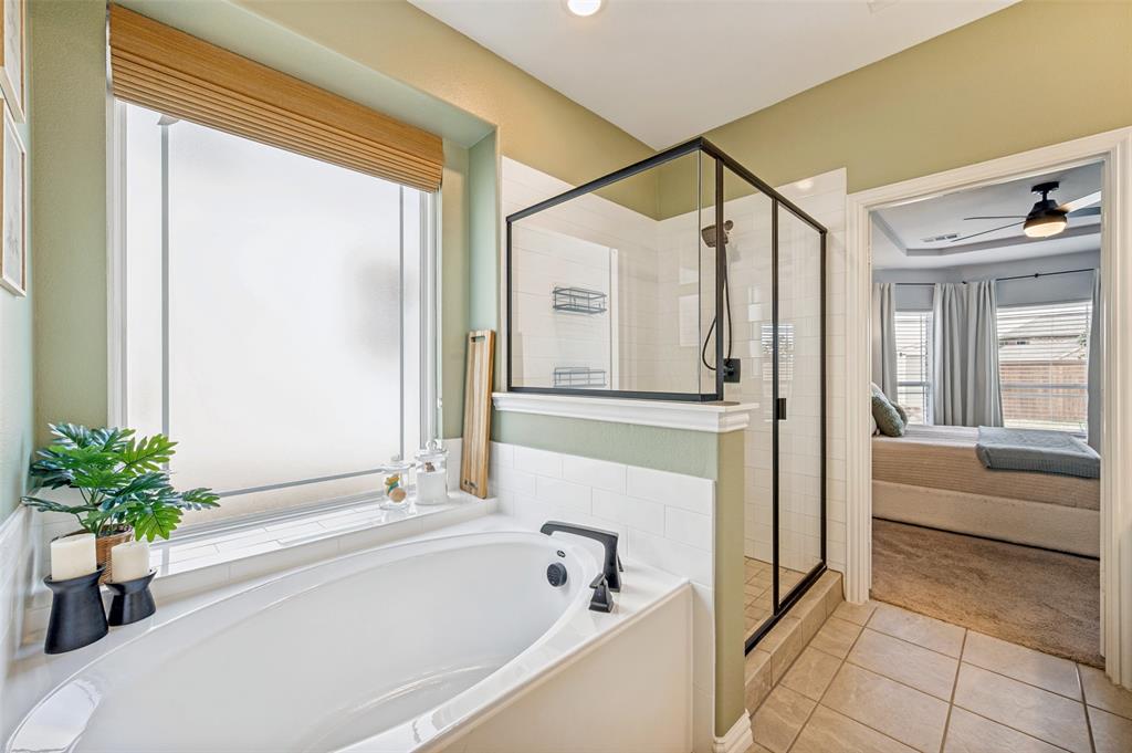 808 Violet Way Celina, TX 75009 - Photo 14 of 30 Primary bath also has step up shower, garden bath tub, and toilet room.