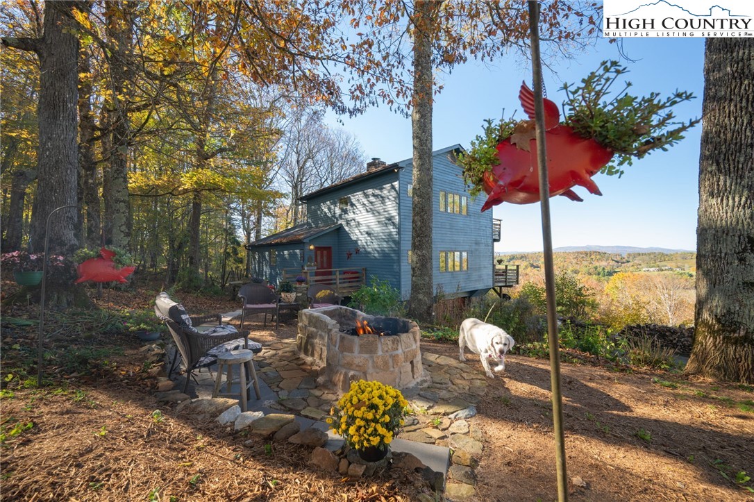 540 Mountain Farm Road Boone, NC 28607 - Photo 15 of 46 a outdoor view of a building with sitting area
