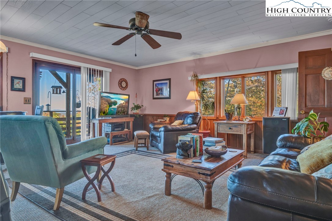 540 Mountain Farm Road Boone, NC 28607 - Photo 18 of 46 a living room with furniture a ceiling fan and a window