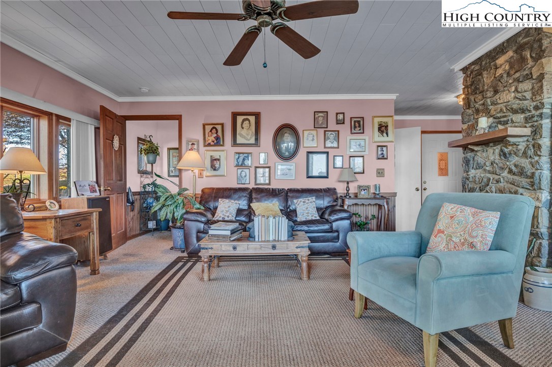 540 Mountain Farm Road Boone, NC 28607 - Photo 20 of 46 a living room with furniture and a clock
