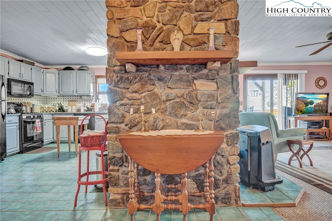 540 Mountain Farm Road Boone, NC 28607 - Photo 22 of 46 a living room filled with furniture and a kitchen view