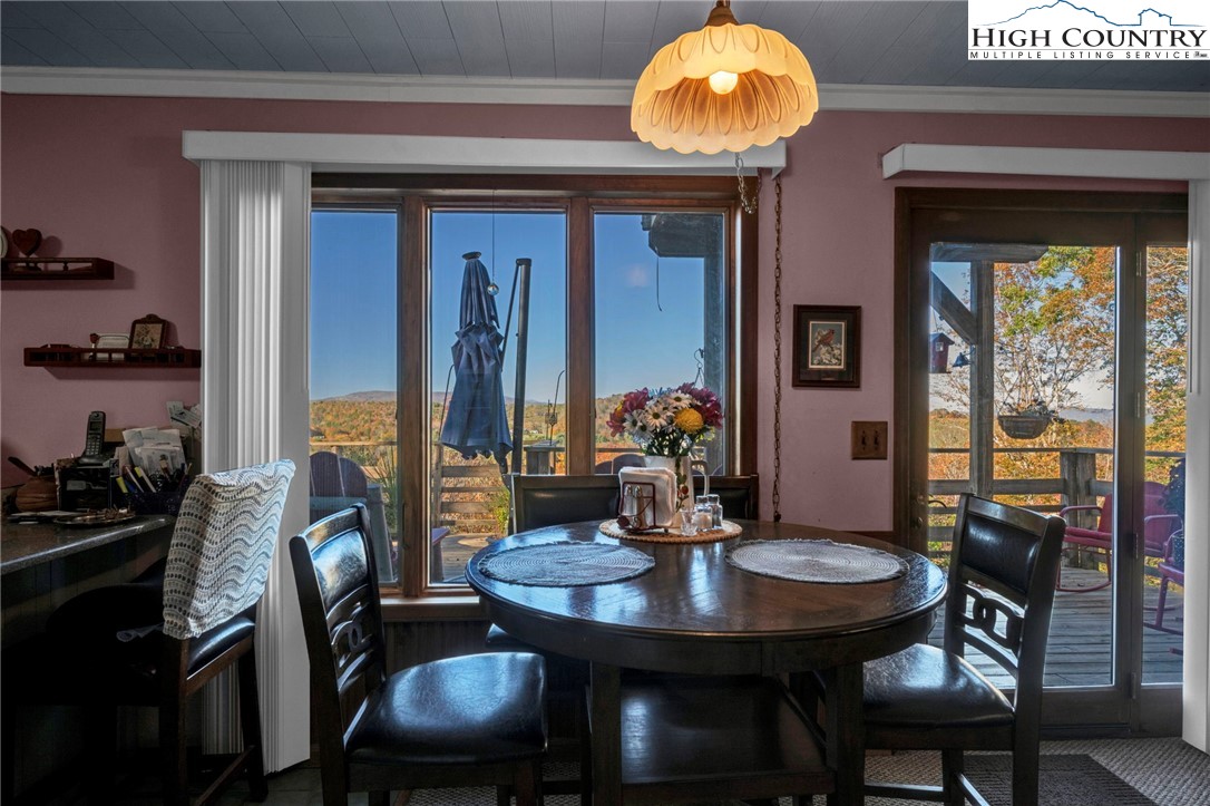 540 Mountain Farm Road Boone, NC 28607 - Photo 24 of 46 a view of a dining room with furniture and chandelier