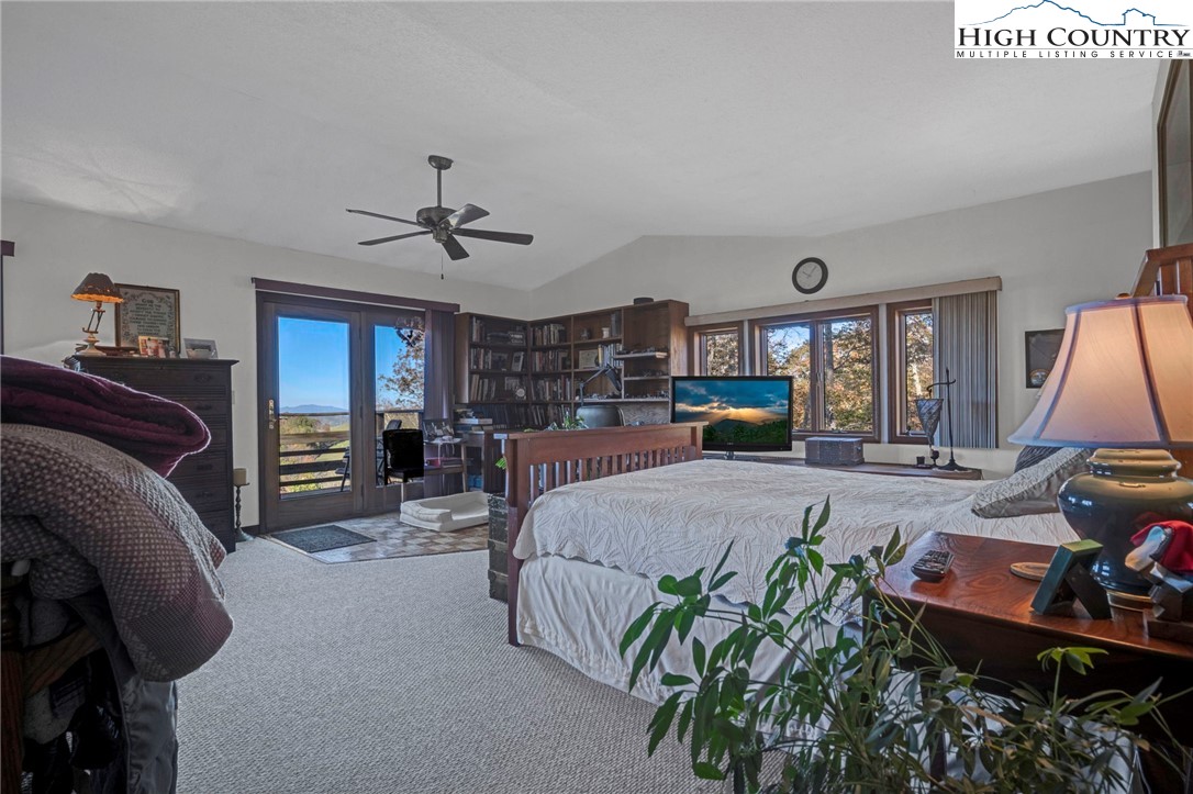 540 Mountain Farm Road Boone, NC 28607 - Photo 34 of 46 a bed room with a bed window and a chair