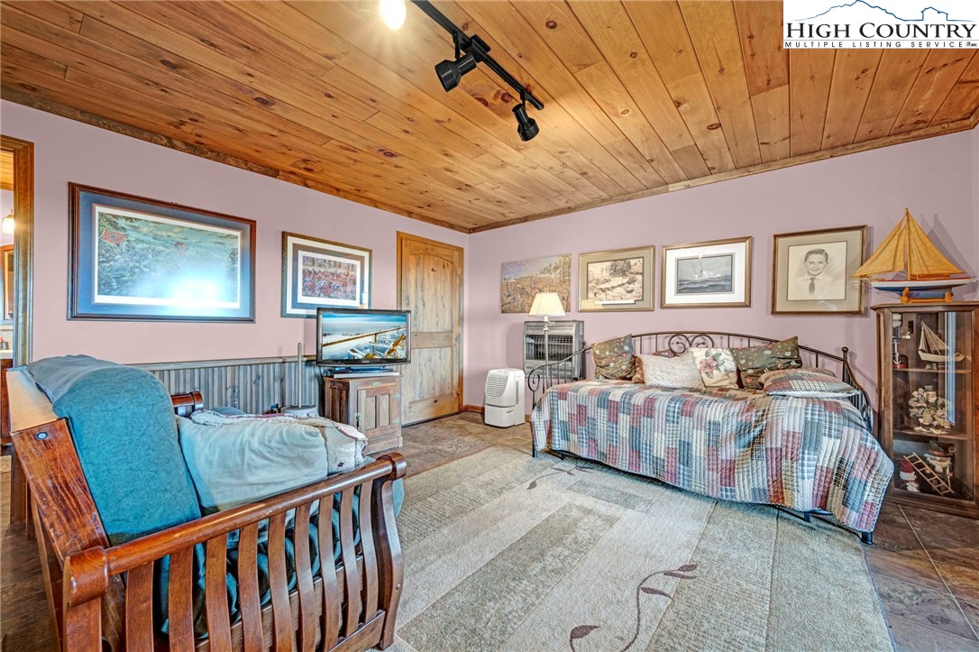 540 Mountain Farm Road Boone, NC 28607 - Photo 39 of 46 a living room with furniture and a flat screen tv