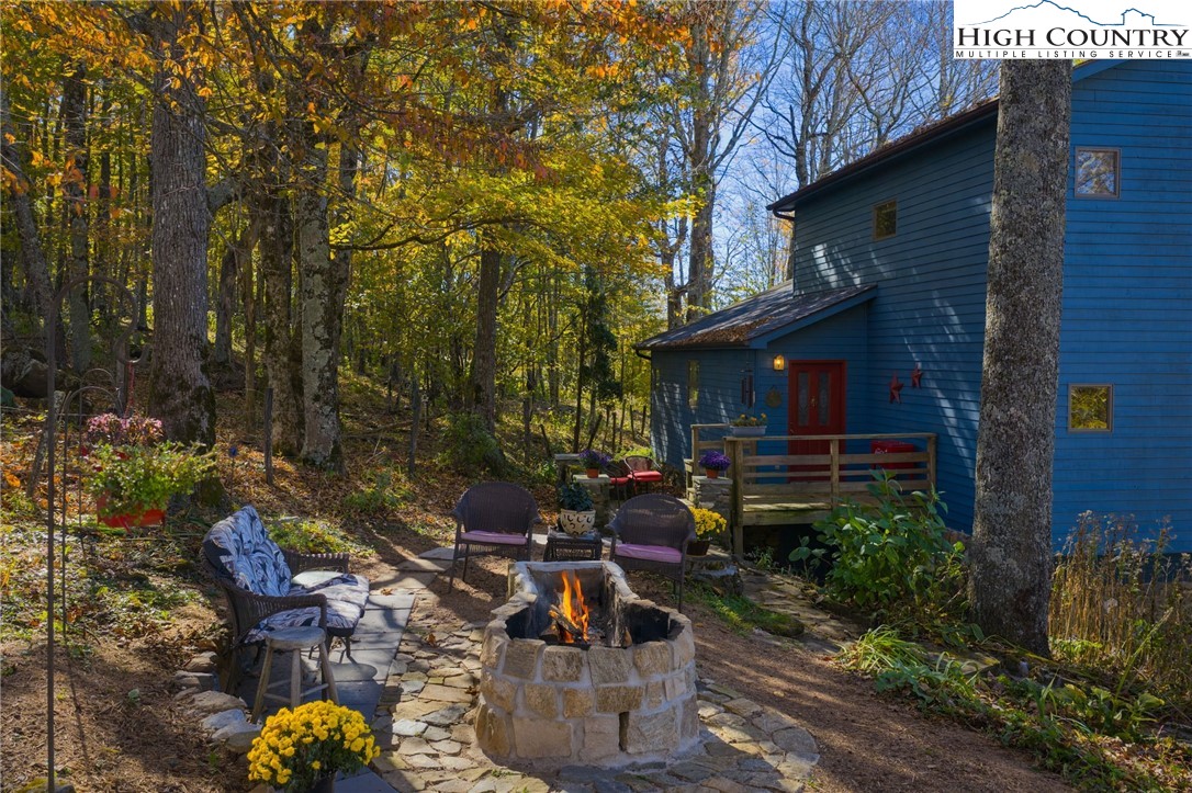 540 Mountain Farm Road Boone, NC 28607 - Photo 7 of 46 a view of a house with backyard water fountain and sitting area