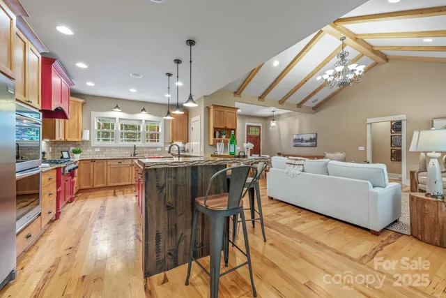 a view of a house with pool and sitting area
