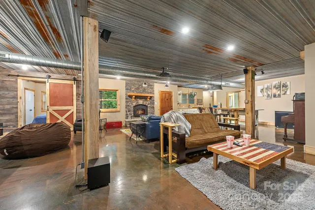 a view of a room with lots of wooden furniture
