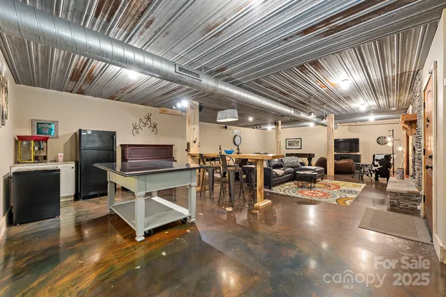 a view of a room with lots of wooden furniture