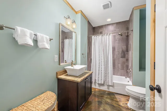 a house with green field in front of it