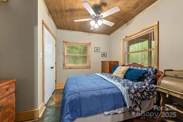 a view of a house with a yard and garden