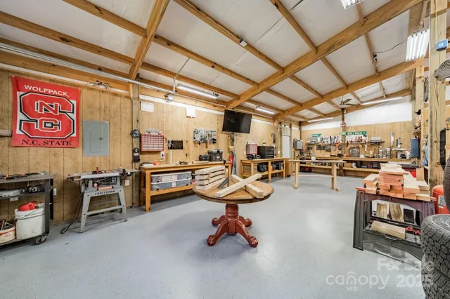 a room with gym equipment and a view of garage