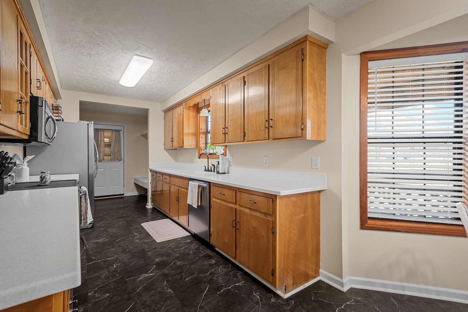 2427 Toler Road Woodlawn, TN 37191 - Photo 17 of 48 a spacious bathroom with a double vanity sink a mirror and a bathtub