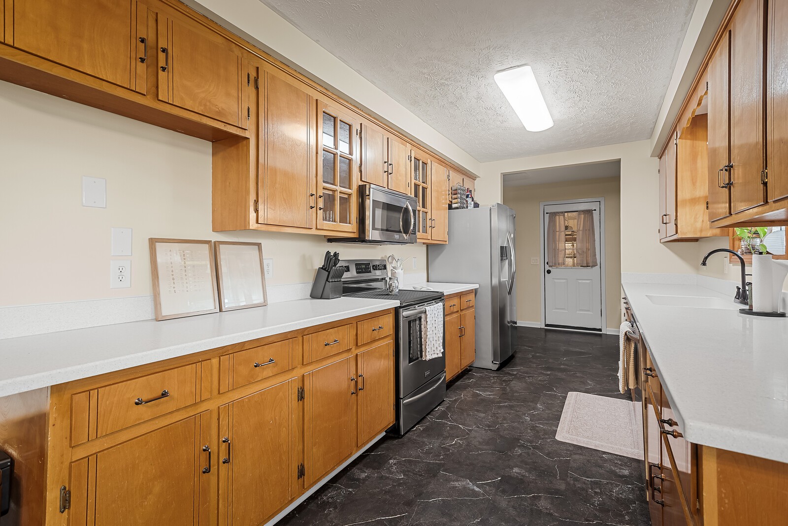 2427 Toler Road Woodlawn, TN 37191 - Photo 19 of 48 a kitchen with sink cabinets and window