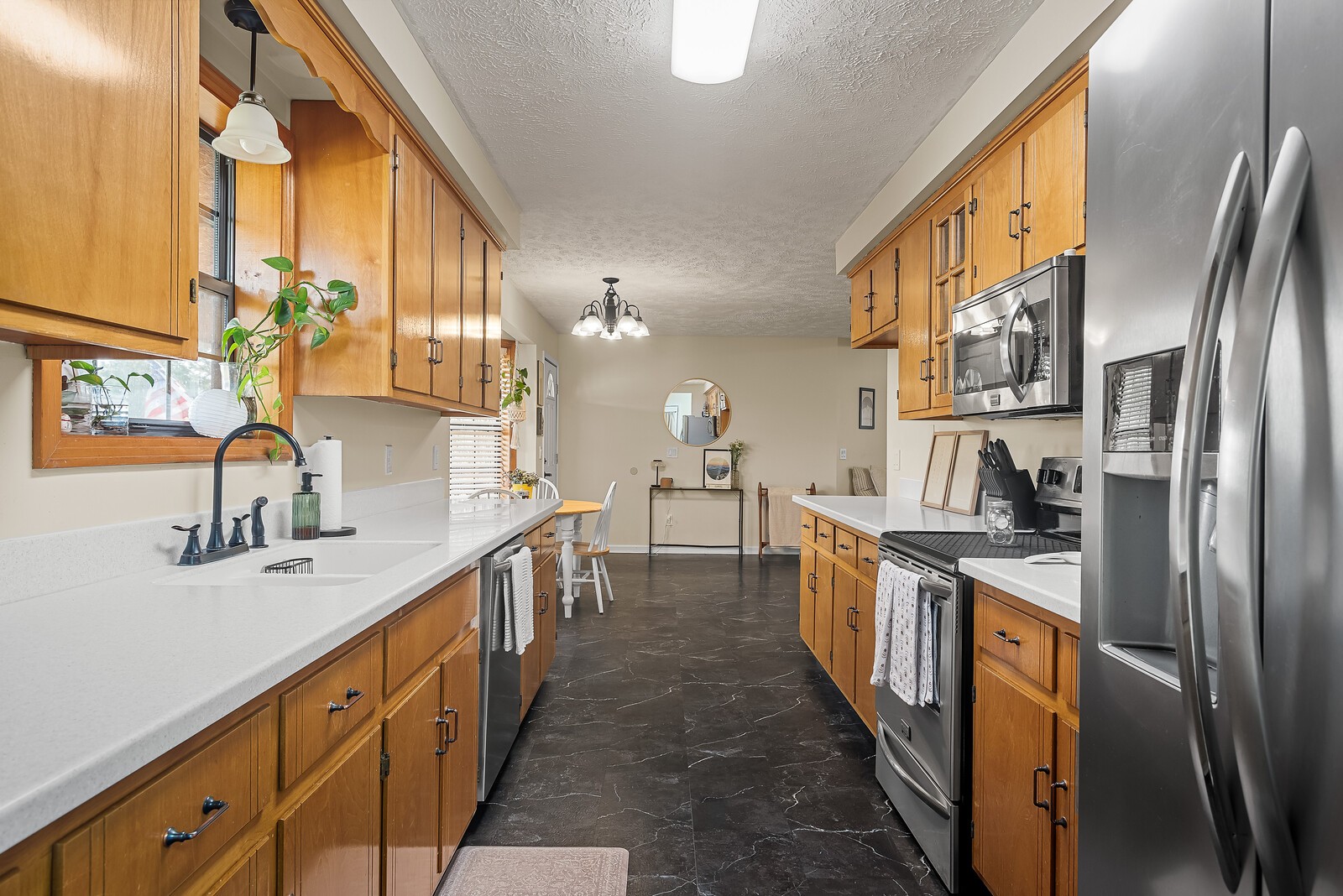 2427 Toler Road Woodlawn, TN 37191 - Photo 21 of 48 a kitchen with stainless steel appliances granite countertop a sink and a refrigerator