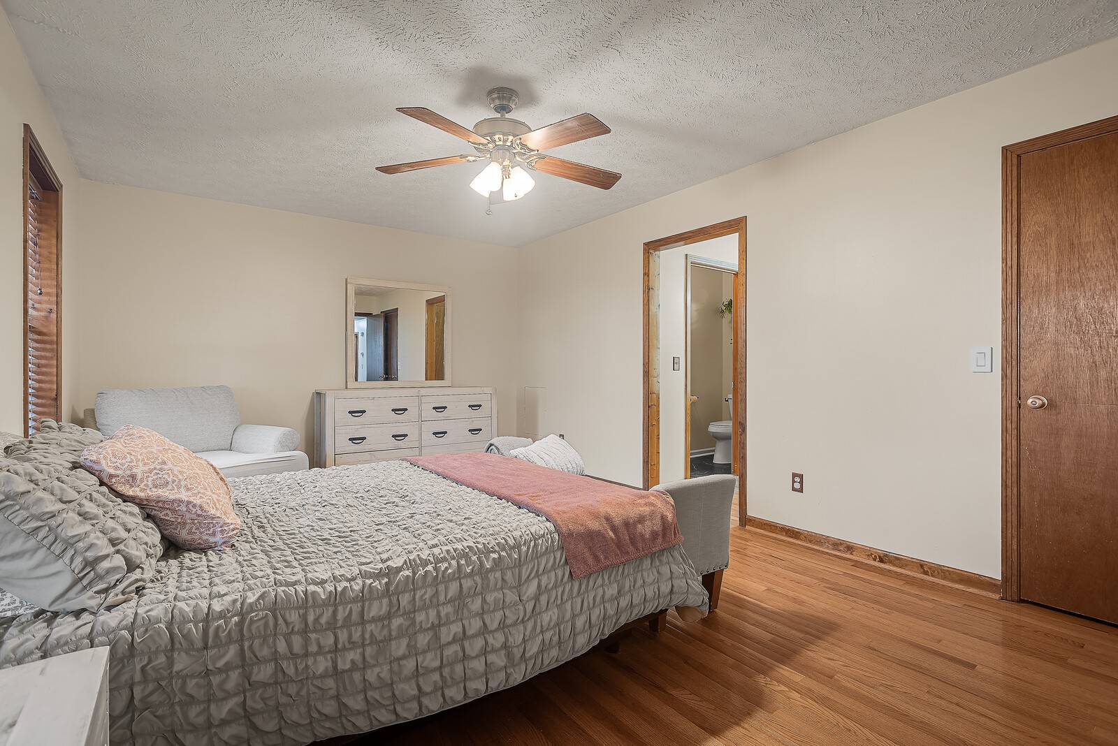 2427 Toler Road Woodlawn, TN 37191 - Photo 25 of 48 a bedroom with a bed and a chandelier